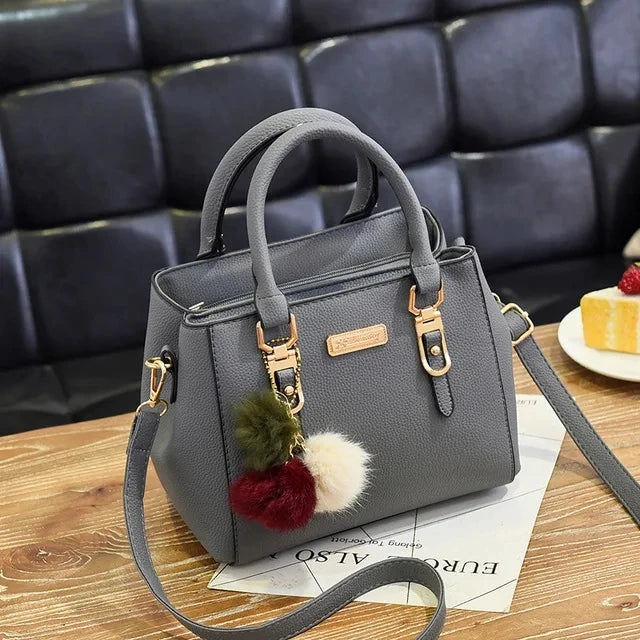 Gusure Embroidered Tote – Elegant, Spacious & Tassel-Accented